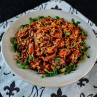 Jambalaya (D) · A spicy, Louisiana rice dish made with, onion, celery, tomato, and cajun gravy.

