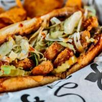 Po' Boy (D) · Toasted French roll lathered with house made remoulade, shredded iceberg lettuce, pickles, f...