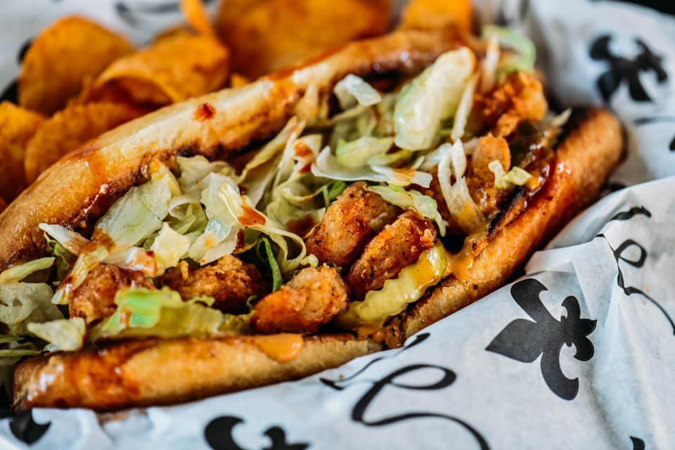 Po' Boy (D) · Toasted French roll lathered with house made remoulade, shredded iceberg lettuce, pickles, fried choice of protein-best with shrimp. Drizzled with tangy tiger sauce, and wrapped in a famous montage tin foil structure.

