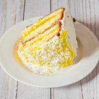 Pineapple Coconut Cake Slice · Classic butter cake layered with pineapple filling then topped with coconut flakes. The refr...