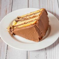 Chocolate Layered Cake Slice · 4 layers of golden butter cake, layered with our creamy chocolate icing. This is our 