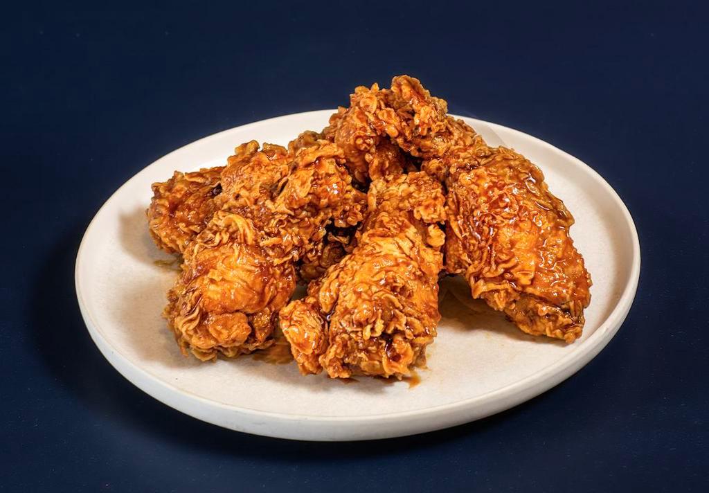 WINGS 20 PIECES · Choice of two sauces,
'Original Golden Crispy' flavor is a plain chicken without sauce. 