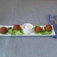 Falafel · Fried chickpeas and vegetables blended with Middle Eastern spices.