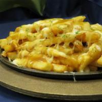 Gravy Fries · Natural cut fries smothered in brown gravy.