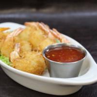 Shrimp Basket 🍤 · Coconut-battered and deep-fried shrimp served with sweet chili sauce for dipping.