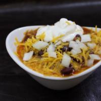 Chili · Our rich and meaty red bean chili served with onions, cheddar cheese, sour cream, and cornbr...