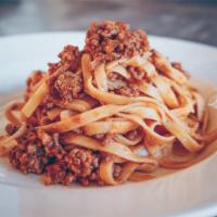 Pasta Bolognese · Sauce made from tomatoes, minced beef, garlic, wine and herbs .