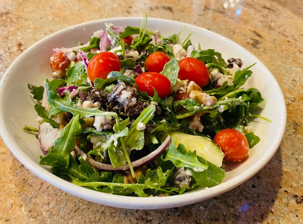 Arugula Salad  · Arugula, red cherry tomatoes, thinly sliced red onions , cucumber, raisins, crushed walnuts and goat cheese 