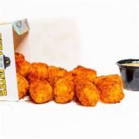 Tyga Tots · Bite-sized pieces of fried potato seasoned with your choice of dust. If you would like multi...