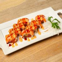 Tiger Roll · Spicy tuna, cucumber, with salmon avocado on top, sushi sauce, masago, and spicy mayo