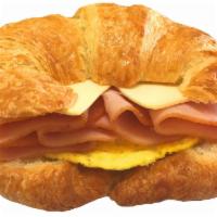 7. Ham, Egg and Cheese Croissant · Freshly cracked egg served on a toasted plain butter croissant with melted American white ch...