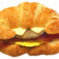 11. Bacon & Sausage, Egg and Cheese Croissant · Freshly cracked egg served on a toasted plain butter croissant with melted American white ch...