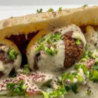 Falafel Sandwich *(vegetarian) · Served with lettuce, tomatoes, onion, pickles. ＆ white sauce
