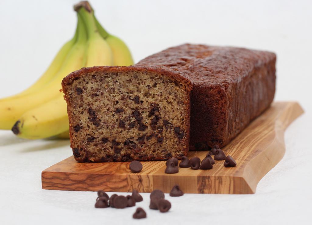 Chocolate Chip Banana Bread · The softness of fresh banana paired with deep rich chocolate chips. Full large loaf ready to slice as you wish. Made in a facility that uses dairy, eggs, nuts, and wheat products.