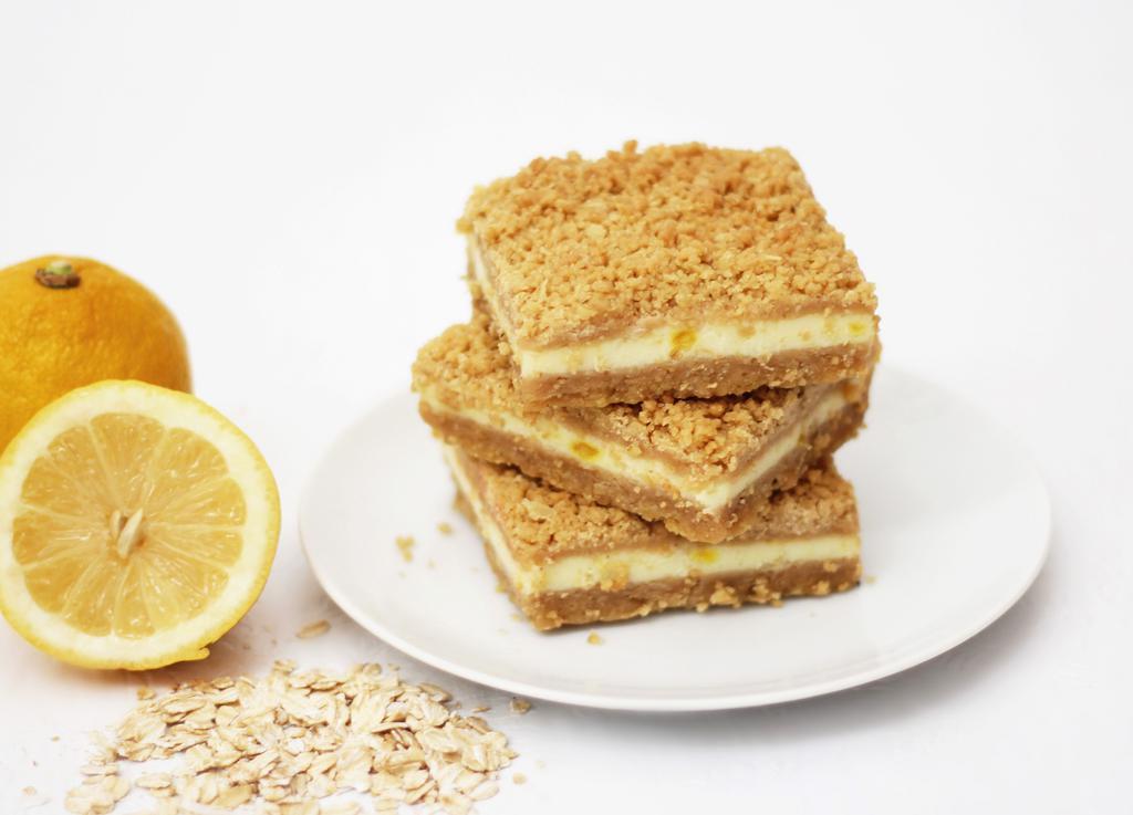 Lemon Oatmeal Bar · Gentle rich lemon filling between sweet oatmeal layers.  Box of 12 bars. Baked in a facility that uses dairy, nuts, and wheat products.
