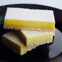 Fresh Lemon Curd Bar · Fresh lemon juice curd atop sweet butter shortbread, dusted with powdered sugar makes an ext...