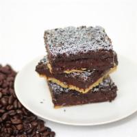 Mocha Bar · Silky espresso fudge filling is smothered on a shortbread crust topped with rich chocolate c...