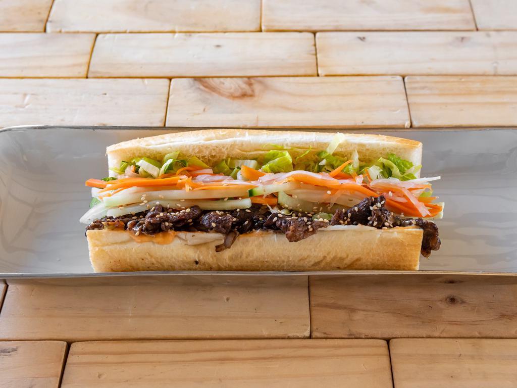 Beef Bulgogi Mi · Beef Bulgogi with fresh cucumbers, jalapenos, spicy aioli, finished fresh scallions and toasted sesame seeds. Add veggies, proteins, sauce, or fried egg for an extra charge.