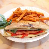 The Vegetarian Panini · Fresh mozzarella, slices of tomato, roasted red peppers, basil and balsamic vinegar.
