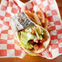 Gyro · Sandwich: served on pita bread with lettuce, tomato, onions and white tzatziki sauce. Platte...