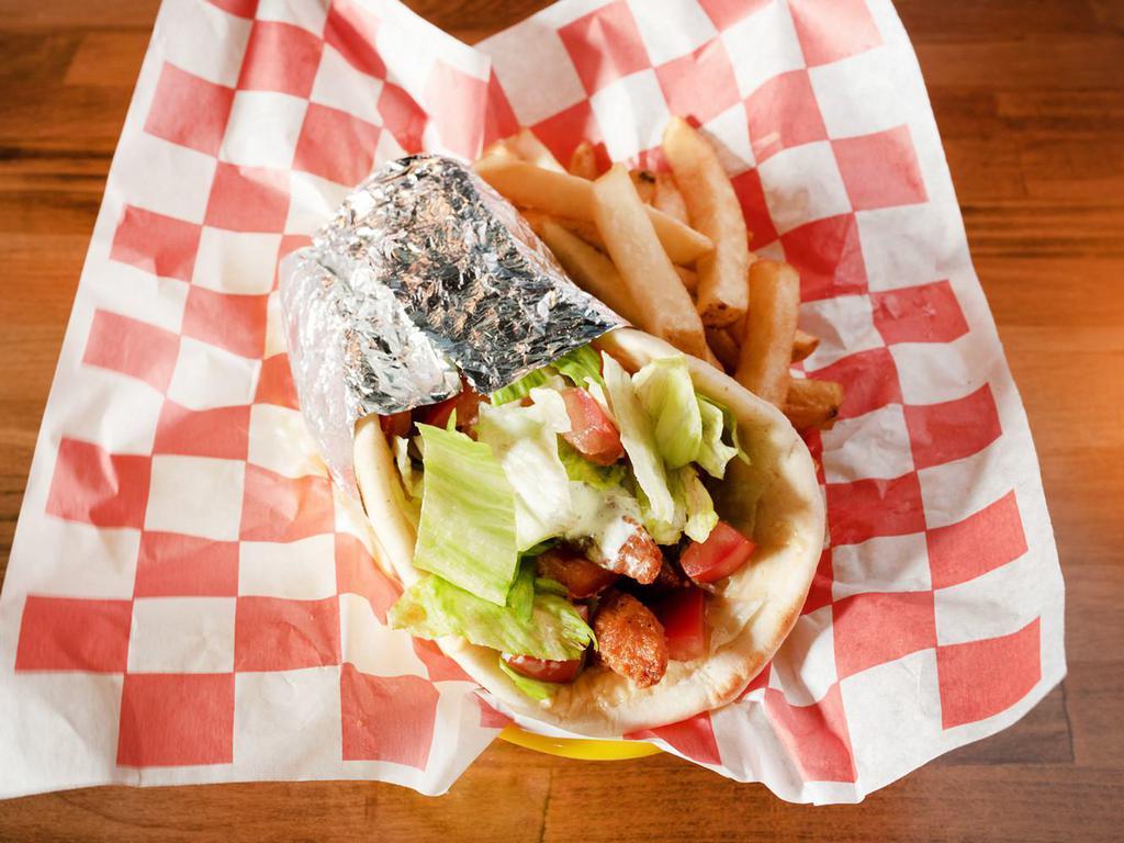Gyro · Sandwich: served on pita bread with lettuce, tomato, onions and white tzatziki sauce. Platter: served with french fries, pita bread and white tzatziki sauce.