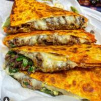 2. Steak Quesadilla · Grilled prime roast beef with cheddar and jack cheeses, salsa and sour cream.