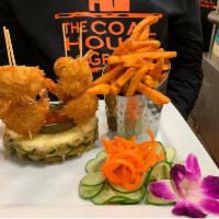 Coconut Shrimp · 6 jumbo shrimp coated in panko bread and coated with coconut flakes fried. Served with sweet...