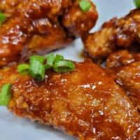 BBQ Fried Chicken Wings · Seasoned wings portions floured and fried, glazed in a sweet honey BBQ sauce (in house sauce).