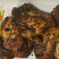 Jerked Chicken Wings · 4 jumbo whole wings, marinated 24 hours in a jerked seasoned, grilled and tossed in jerk gla...