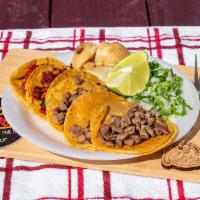 Mixtos · 3 corn tacos steak and 2 corn tacos trompo with grilled onions, roasted potato, cilantro, an...