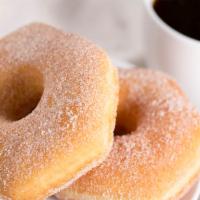 Dona de Azucar · Donut powdered in sugar.