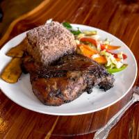 Jerk Chicken · Served with rice and peas, white rice or macaroni and cheese, salad or veggies and plantains.
