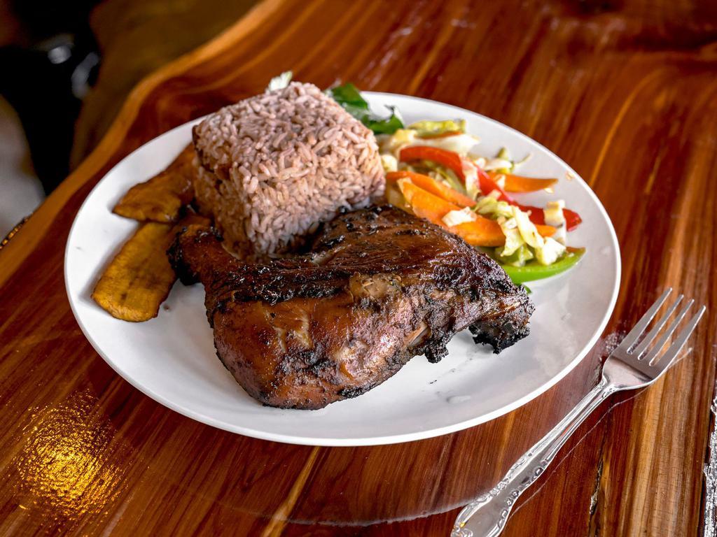Jerk Chicken · Served with rice and peas, white rice or macaroni and cheese, salad or veggies and plantains.