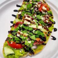 The Greek · Thick cut toast, mashed avocado, cherry tomatoes, cucumbers, red onion, feta cheese, cilantr...