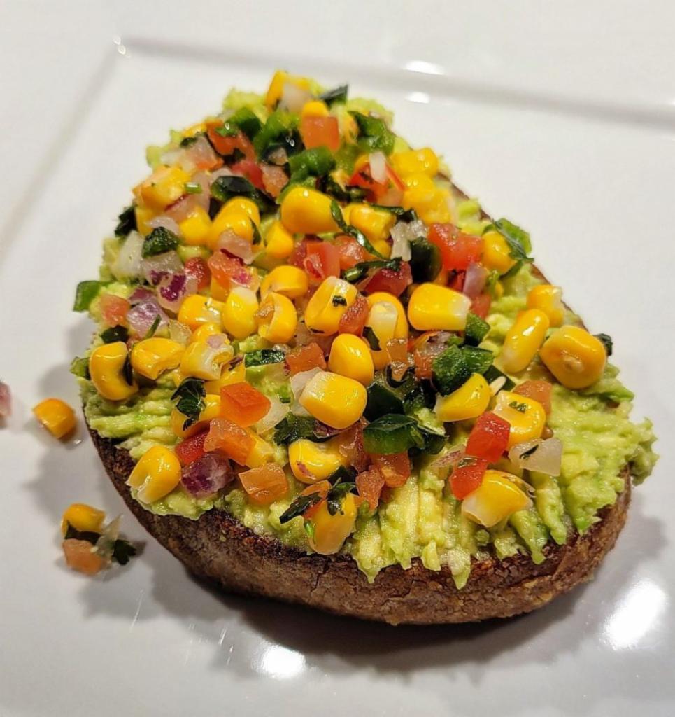 Fiesta Toast · Sweet corn, tomatoes, pepper, red onion, lime, cilantro and mashed avocado