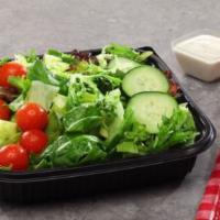 Garden Salad · A delightful mix of romaine, iceberg and tender spring mix lettuces topped with cherry tomat...