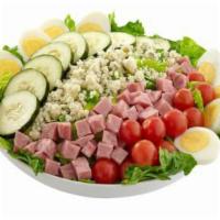 Cobb Salad · A delightful mix of blue cheese crumbles, ham, cherry tomatoes, cucumbers and hard- boiled e...