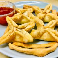 10A. Crab Ragoon · Four piece Crispy Cream Cheese Wontons with sweet spicy sauce