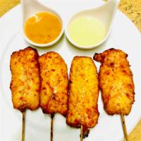 13. Satay · Grilled chicken or beef marinated in Thai herbs and served with a peanut sauce and cucumber ...