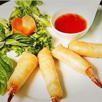 17. Shrimp Mermaid · Deep fried marinated whole shrimps wrapped with egg roll skin, served with sweet chili sauce.