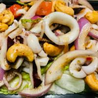 5. Yum Pla Muck Calamari Salad · Comes with a dressing of lime juice, fish sauce, lemongrass, chili and mint leaves. Hot, swe...