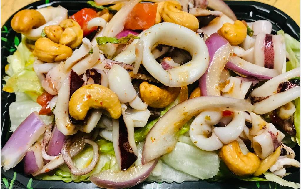 5. Yum Pla Muck Calamari Salad · Comes with a dressing of lime juice, fish sauce, lemongrass, chili and mint leaves. Hot, sweet, and spicy flavor.