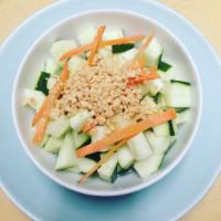7. Cucumber Salad · Cucumber, carrots topped with Thai sweet and sour dressing and ground peanuts.