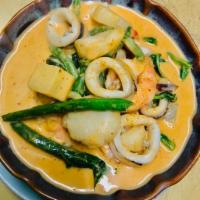 34. Red Curry · Spicy red curry with shrimp, scallops, calamari, string beans, pineapple and coconut milk. H...