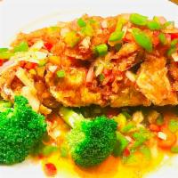 49. Tamarind Whole Fish · Deep fried crispy red snapper with chili, garlic and tamarind sauce. Hot and spicy. 