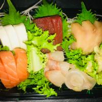 46. Sashimi Deluxe · 18 pieces assorted sashimi. Served with choice of side.