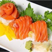 57. Sake Don · 14 pieces fresh salmon sashimi over seasoned rice. Served with choice of side.