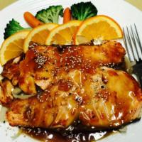 134. Salmon Teriyaki · Grill dish served in teriyaki sauce and with onion. Served with choice of side and rice.