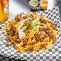 Asada Fries · French fries, jack and cheddar cheese, sour cream, guacamole tomatoes jalapenos and choice o...