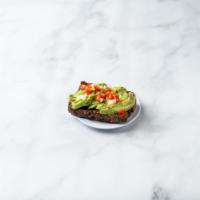 Classic Avocado Toast · Avocado, greens, tomato, onion, salt and pepper, red pepper flakes, and olive oil.